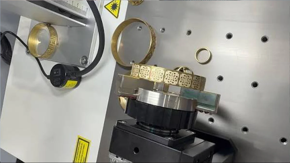 Rings and bracelets positioned for laser engraving and jewelry marking
