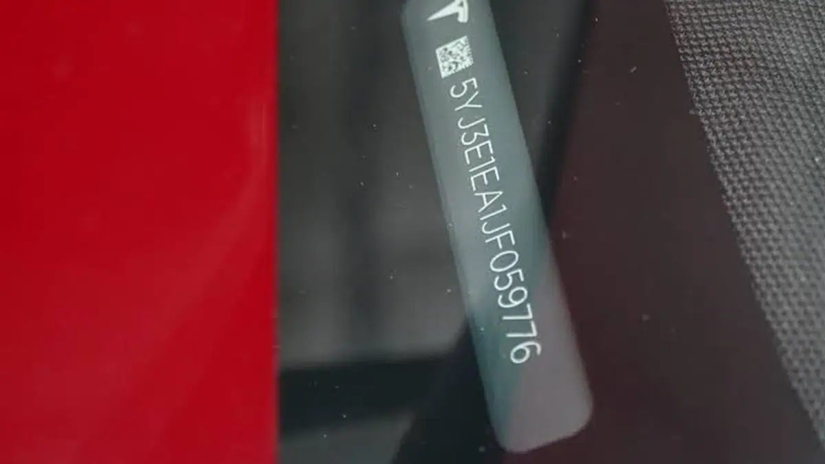 VIN-style identification marking on a metal vehicle-frame component