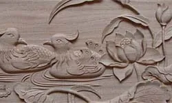 Relief-carved panel with floral and bird motifs