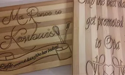 Two light-toned boards with dark cursive marks