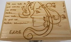 Light-toned plaque with a line-art portrait and text