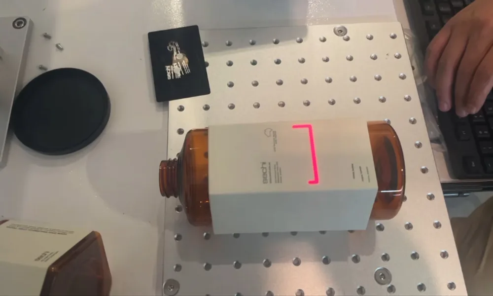Red light positioning frame aligned on an actual workpiece before laser marking