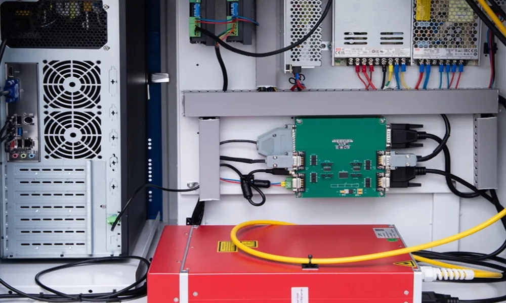 Electrical and control components installed inside a laser marking machine cabinet