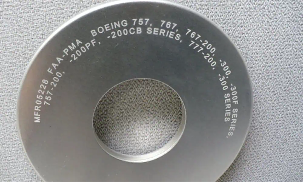 Laser marked aluminum component with permanent alphanumeric identification