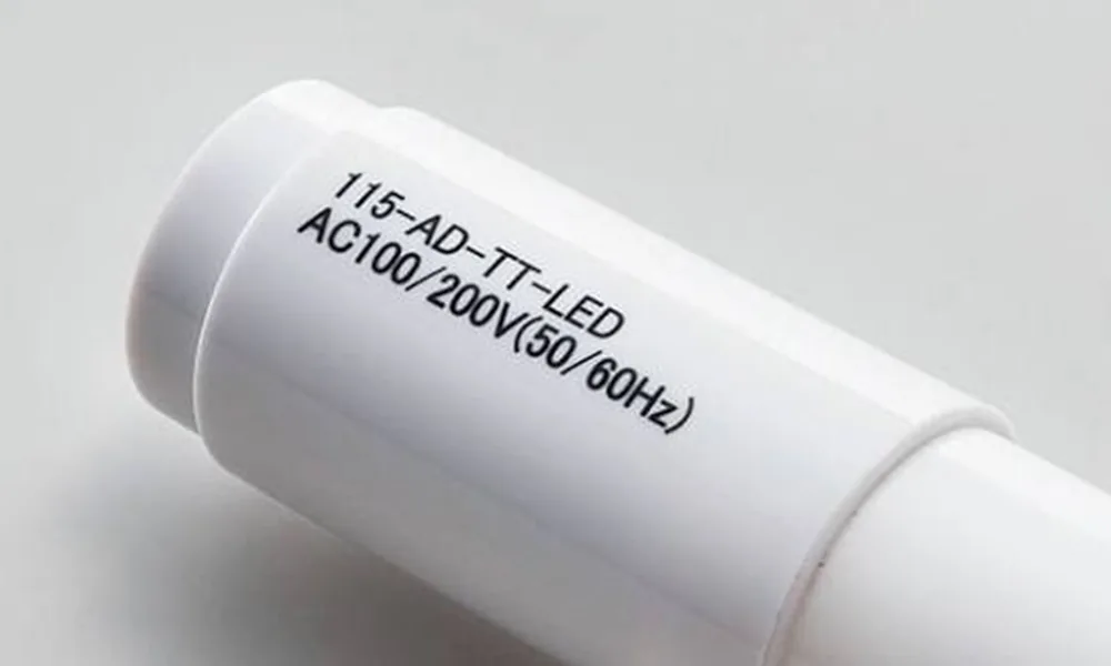 Dark identification mark on a white polyethylene tube surface