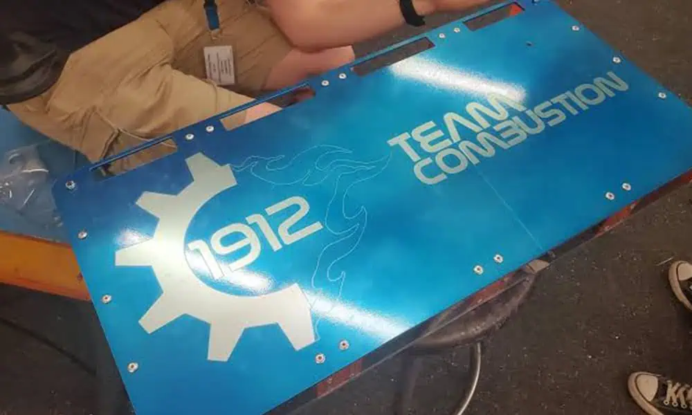 Laser marked coated aluminum panel with mounting holes and large graphics