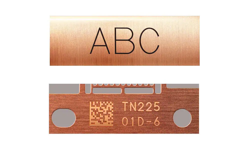Representative laser-marked copper samples showing dark and light identification marks