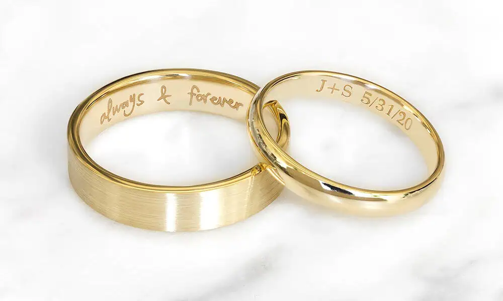 Laser marked inner text on two gold rings