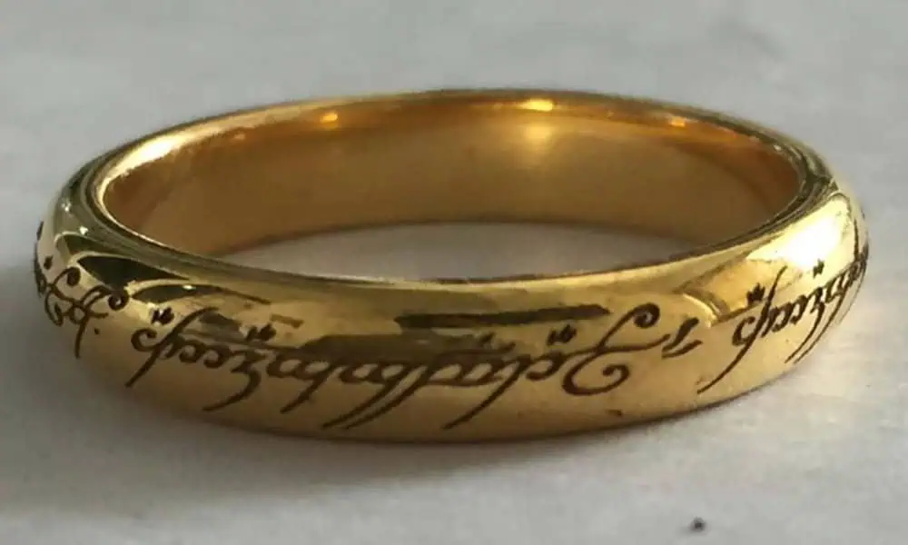 Laser marked text on a polished gold ring