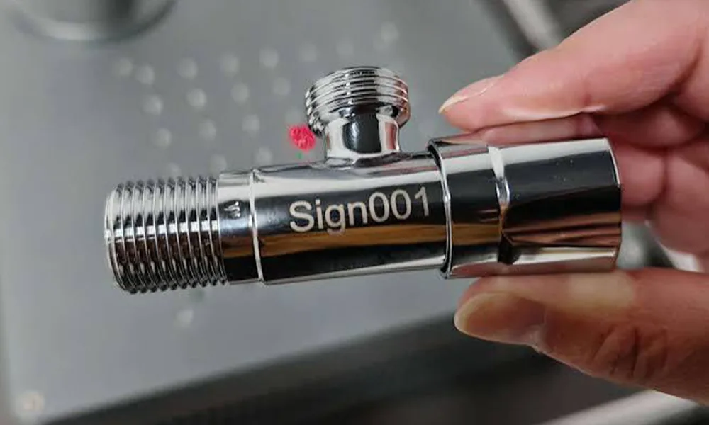Laser-marked bright plated threaded metal component showing a mark on the plated outer surface
