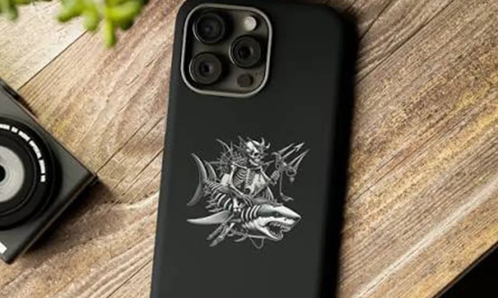 Laser-marked black rubberized phone case with a detailed decorative graphic
