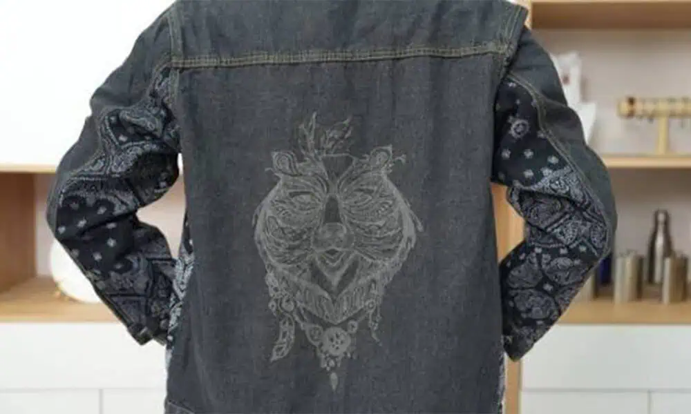 Decorative laser-marked pattern on the back of a denim jacket