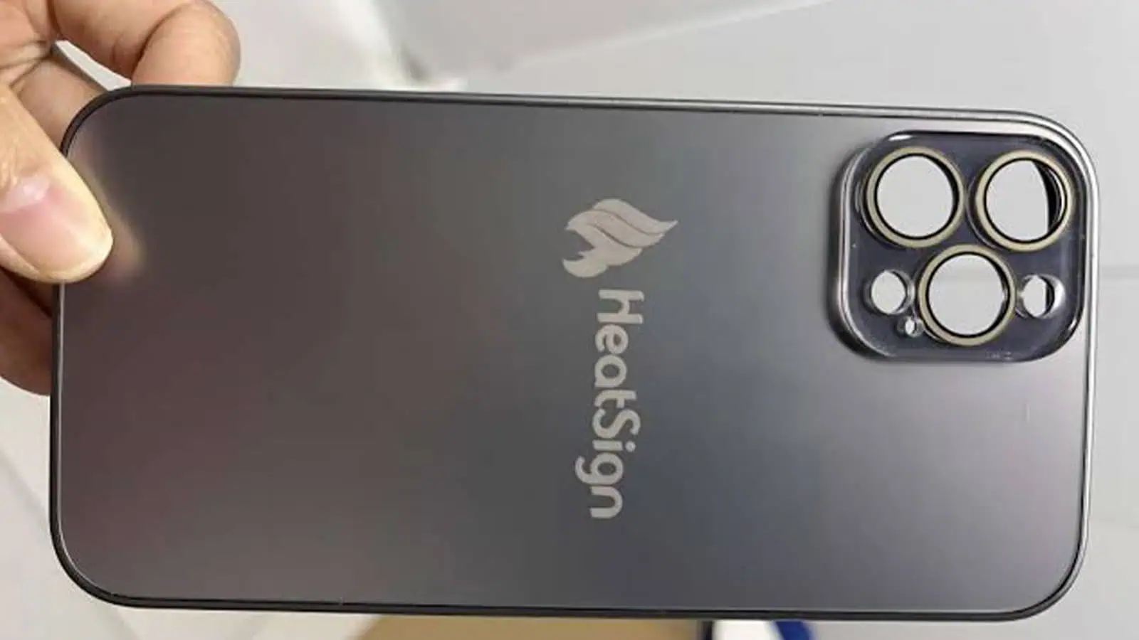 Mobile phone housing with exterior laser-marked logo