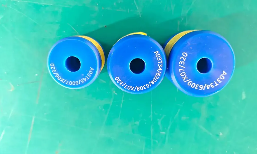 UV laser marking example on blue nylon parts with white identification codes
